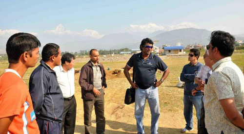 Rumesh Ratnayake inspects Pokhara cricket ground.