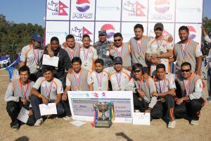 Players of winner APF Club pose for a photograph after winning the Pepsi Standard Chartered T20 National Cricket Tournament on Saturday at the TU Cricket Ground, Kirtipur. (Photo Courtesy: CAN