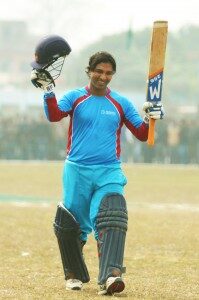 Mehboob Aalam waves his bat after scoring century.(Photo Courtesy: Mahesh Shah)