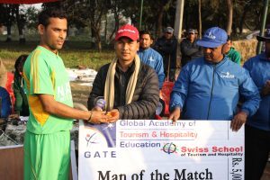 Nepal Sports Journalist Forum (NSJF) President Niranjan Rajbanshi hands over award to the man-of-the-match Rahul Singh after the semifinal match between NASA and Mahendra Namuna.