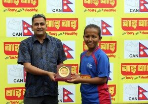 Kajol Shrestha of Biratnagar receives player-of-the-match trophy