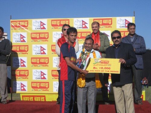 Man of the series Lalit Singh Bhandari being presented with a cheque by Chaudhary Group AGM Lal Babu Sah